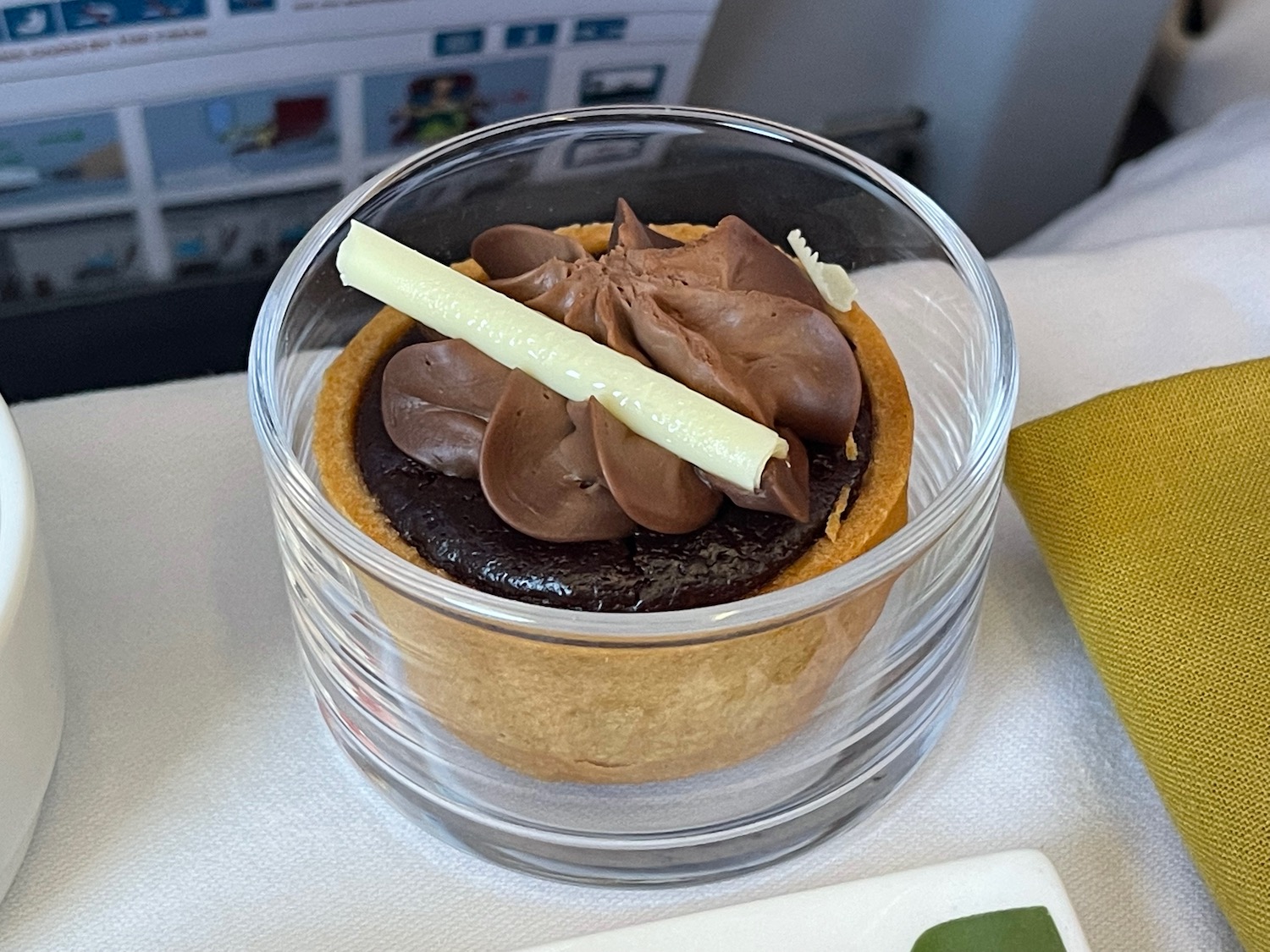 a dessert in a glass container
