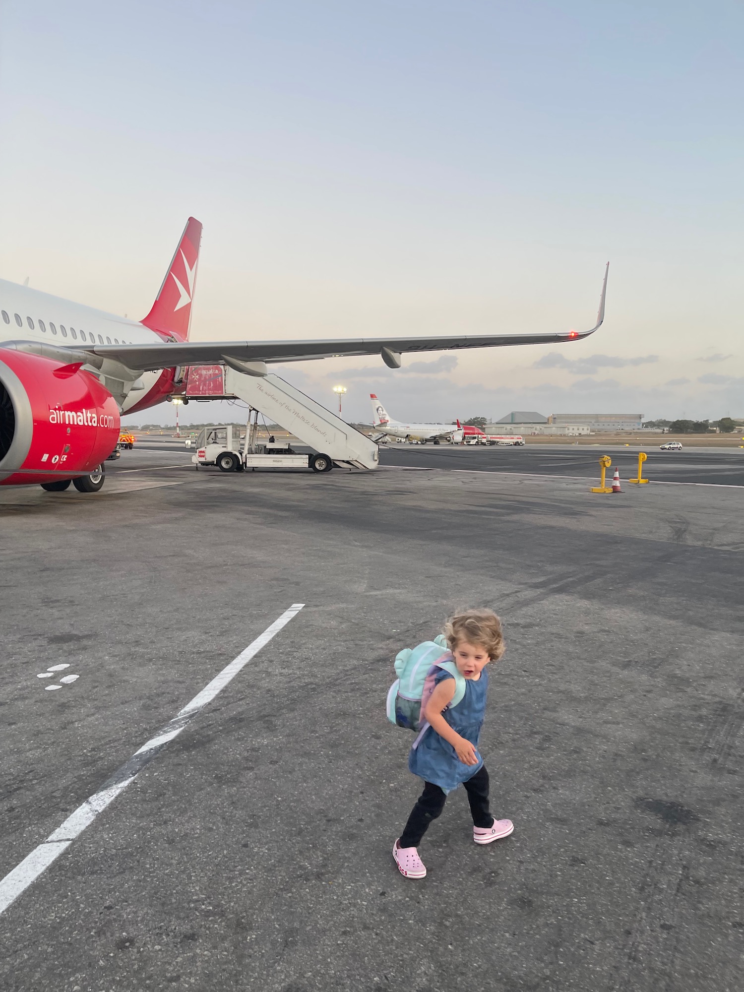 a child walking on a runway