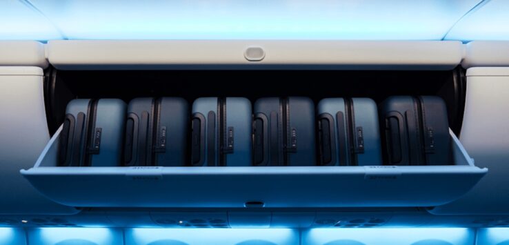a group of luggage in a shelf