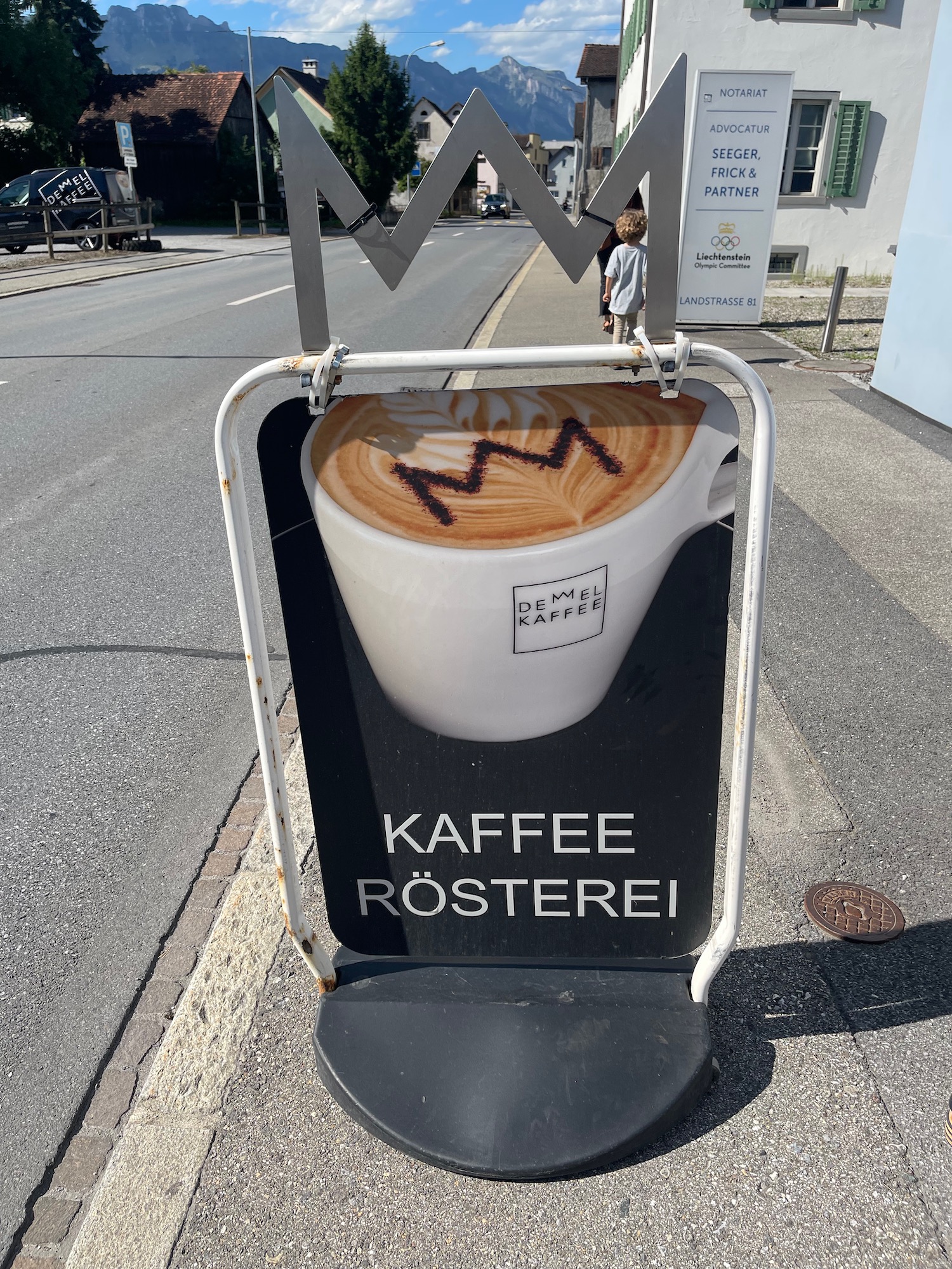 a sign on the sidewalk