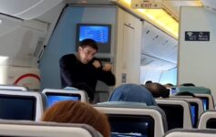 a man standing in an airplane