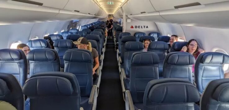 a group of people sitting in an airplane