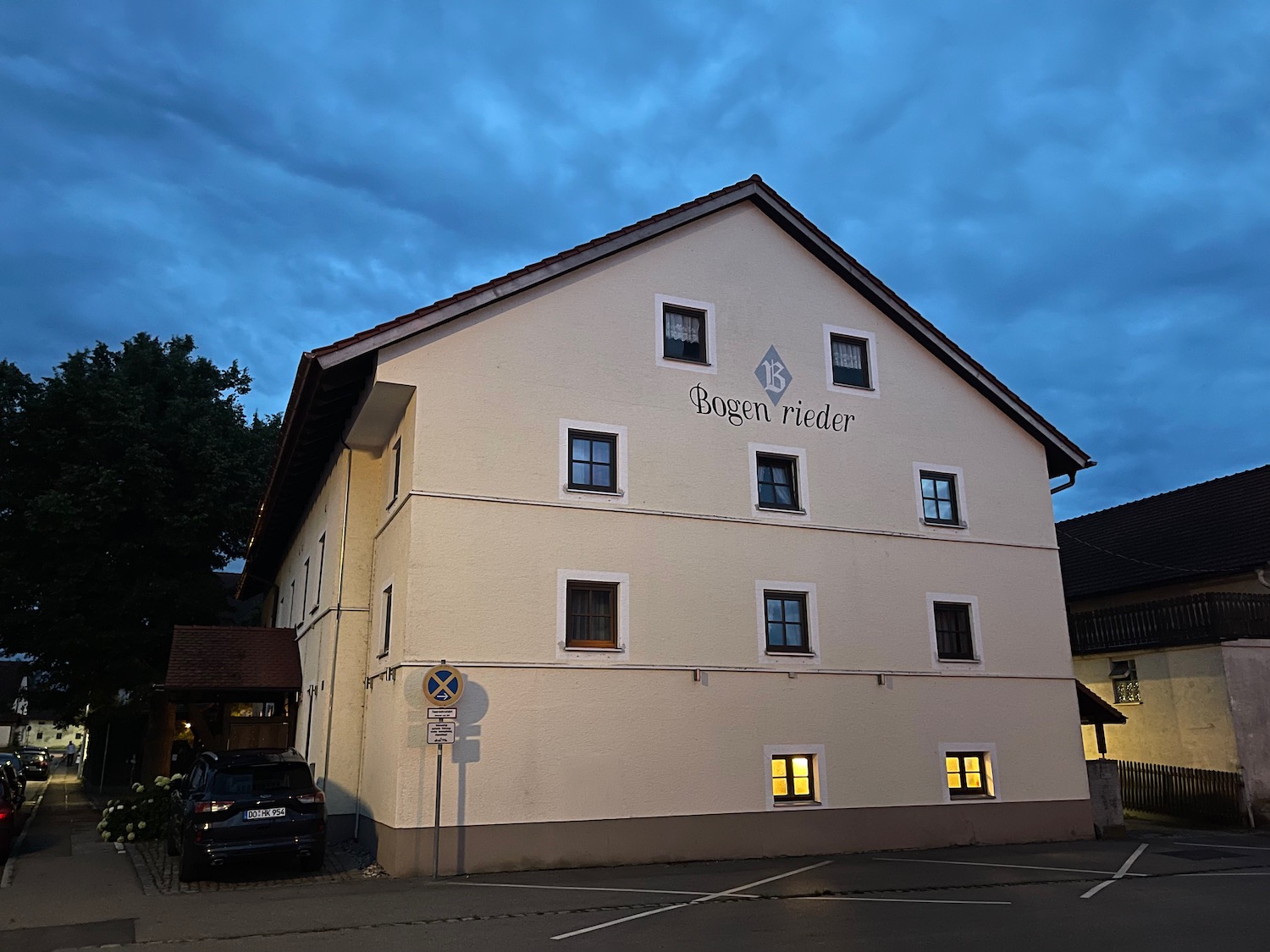 a building with a parking lot and a parking lot