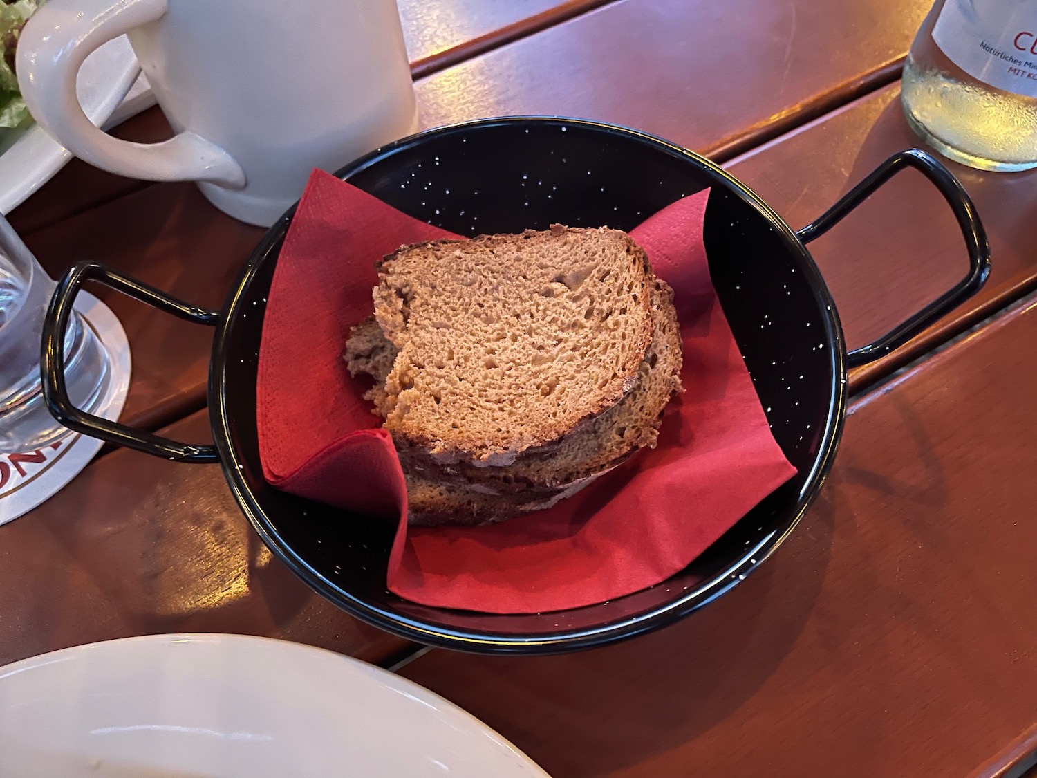 a piece of bread in a black bowl