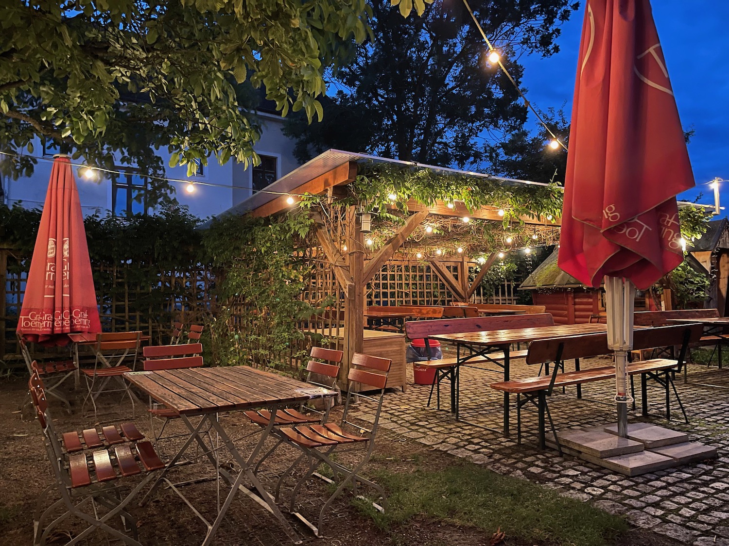 a patio area with tables and chairs