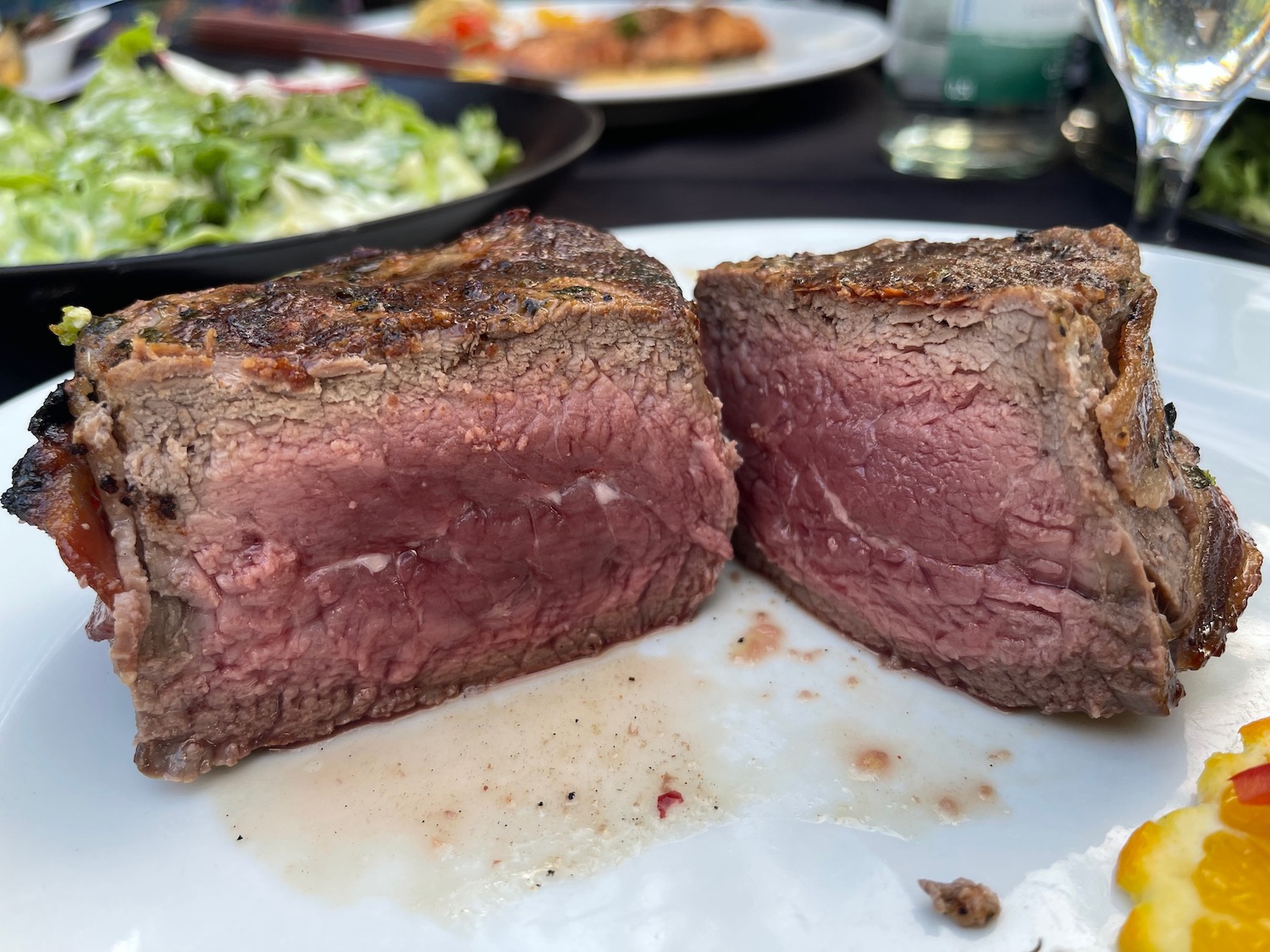 a steak cut in half on a plate