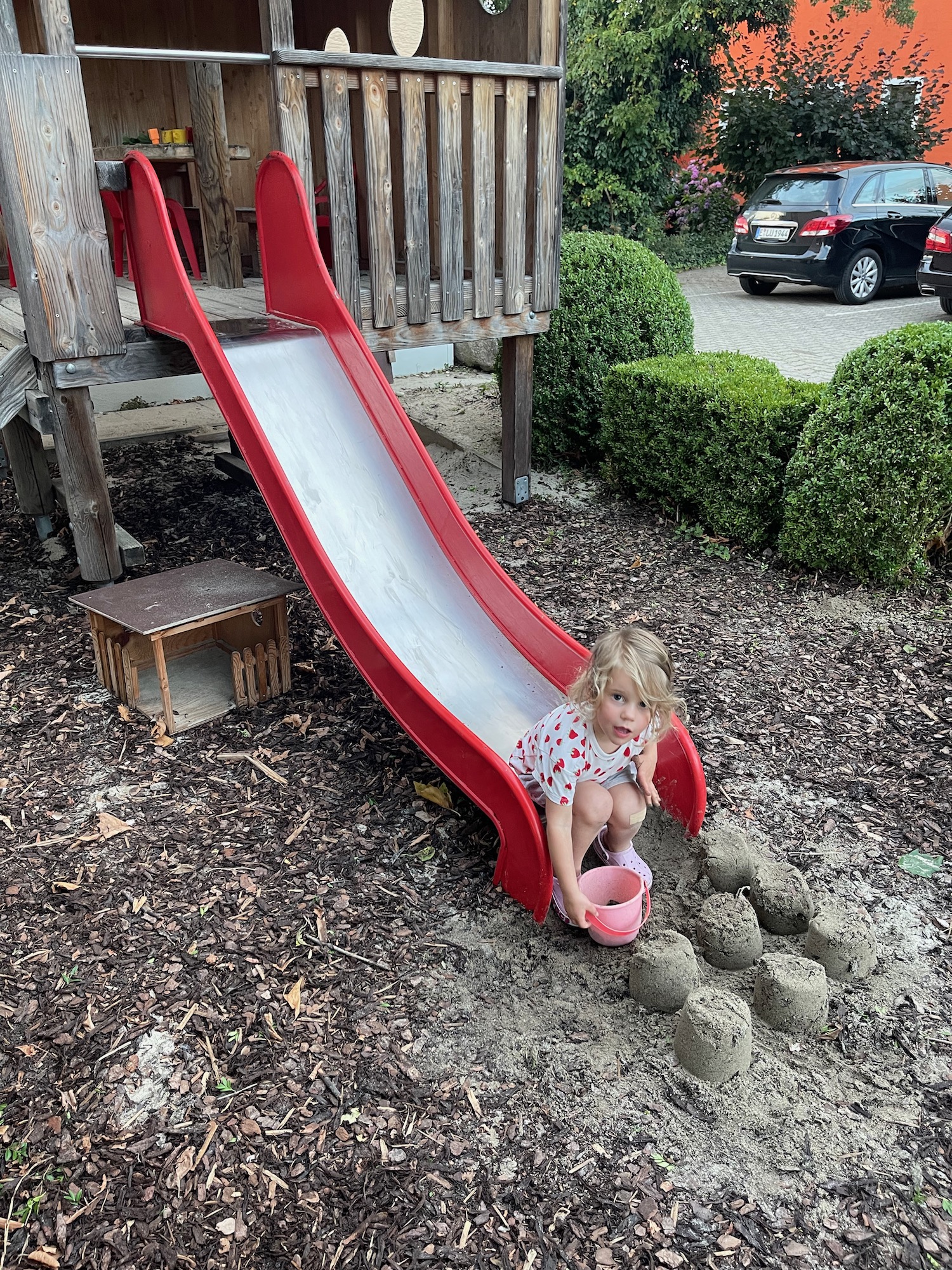 a girl playing on a slide