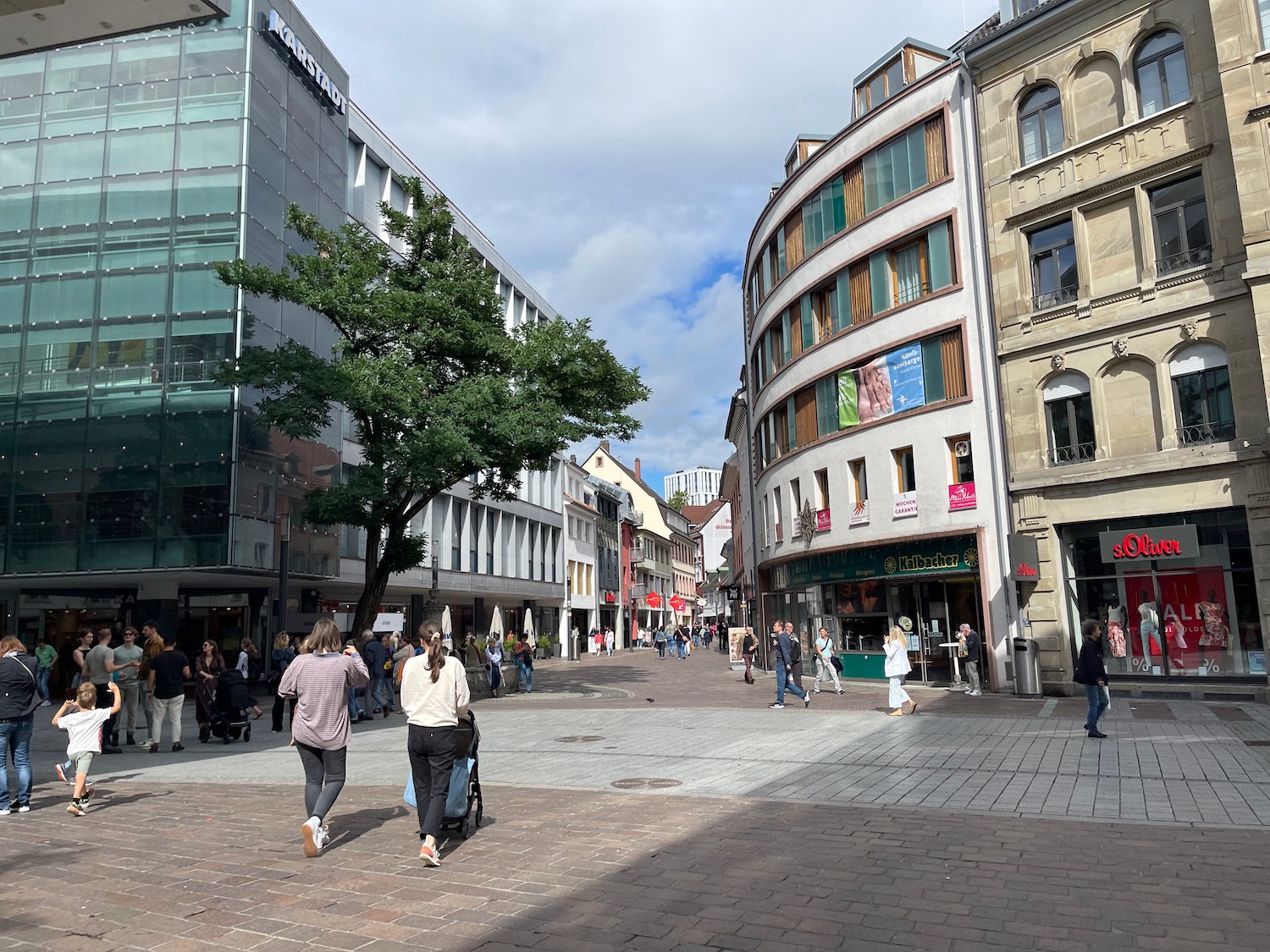 a group of people walking in a city