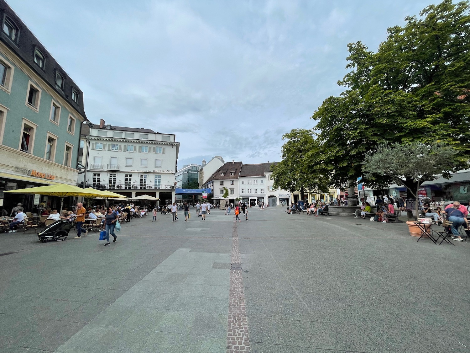 a group of people in a plaza