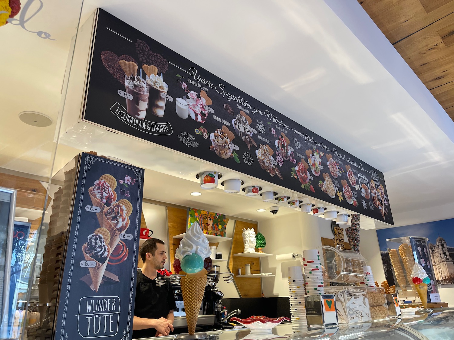 a man standing behind a counter in a store