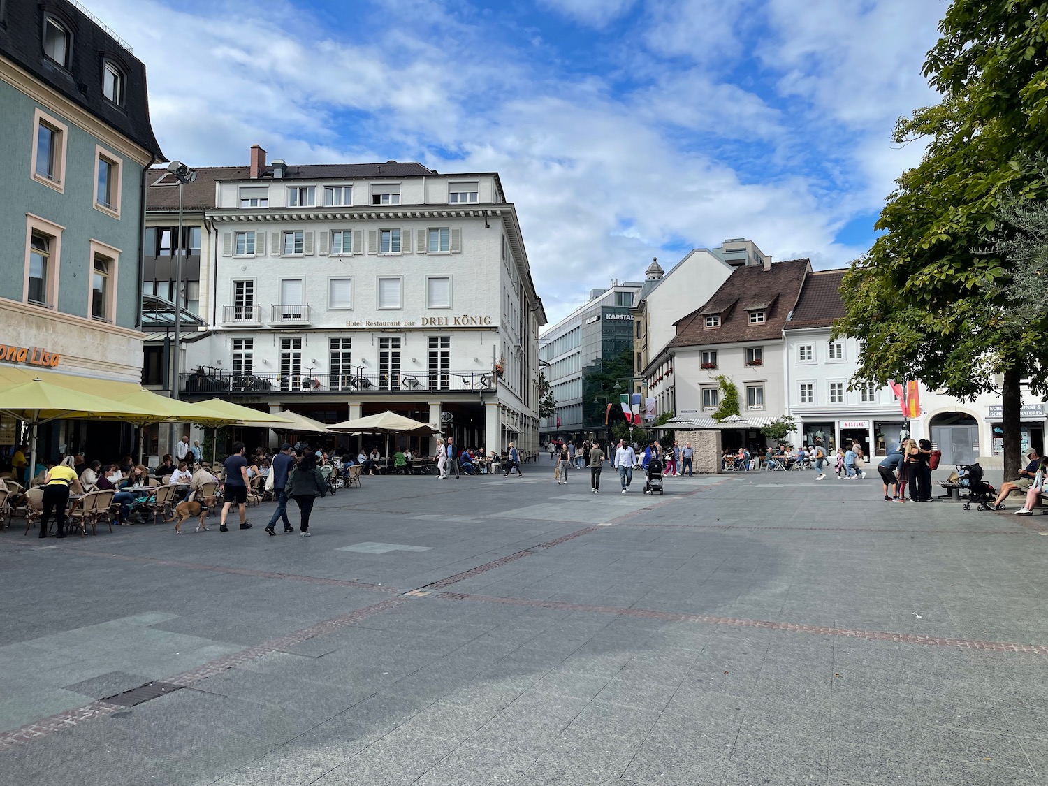 a group of people walking in a city