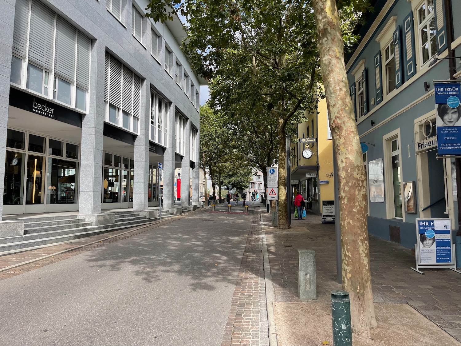 a street with buildings and trees