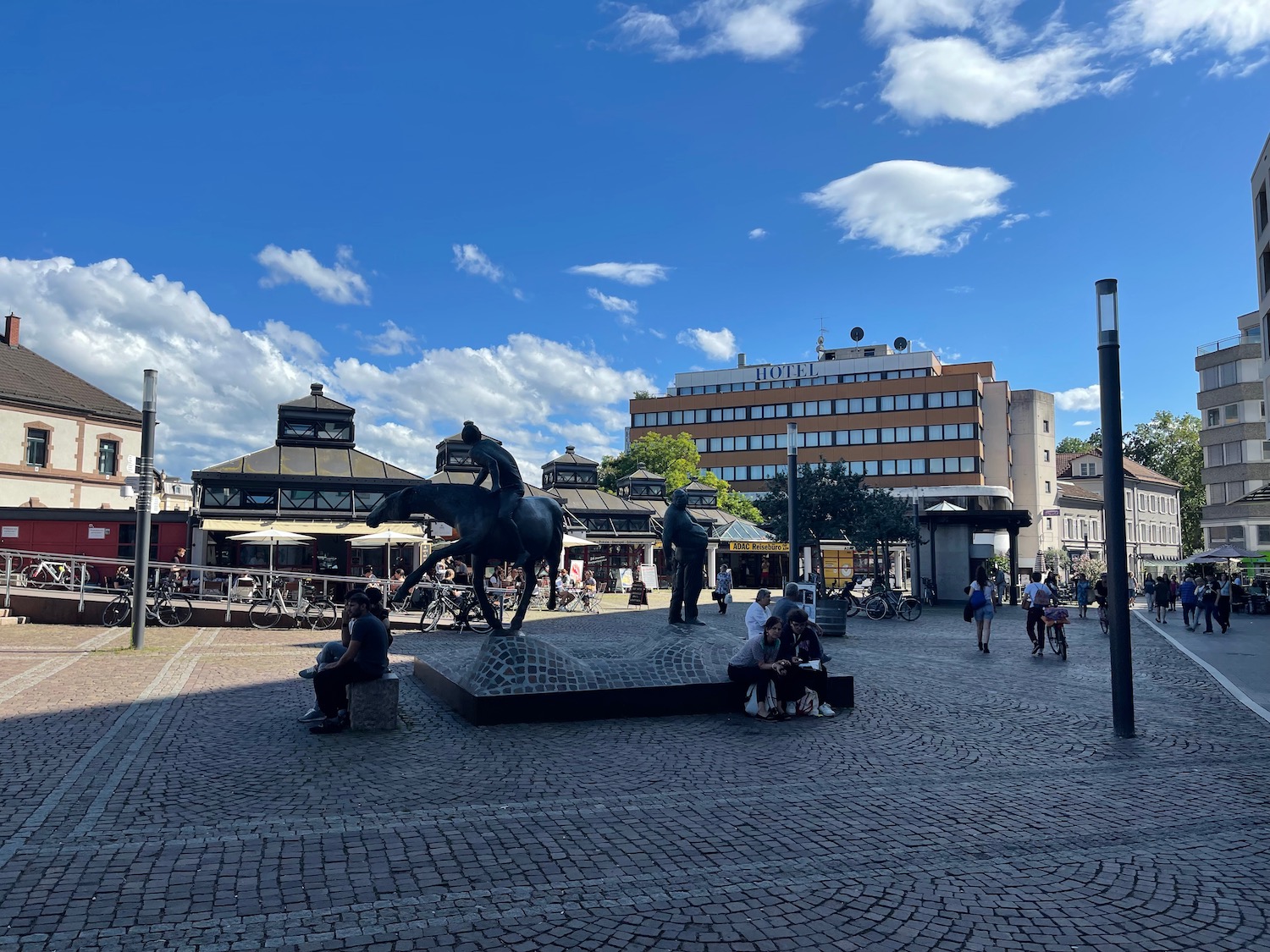 a statue of a man on a horse in a plaza