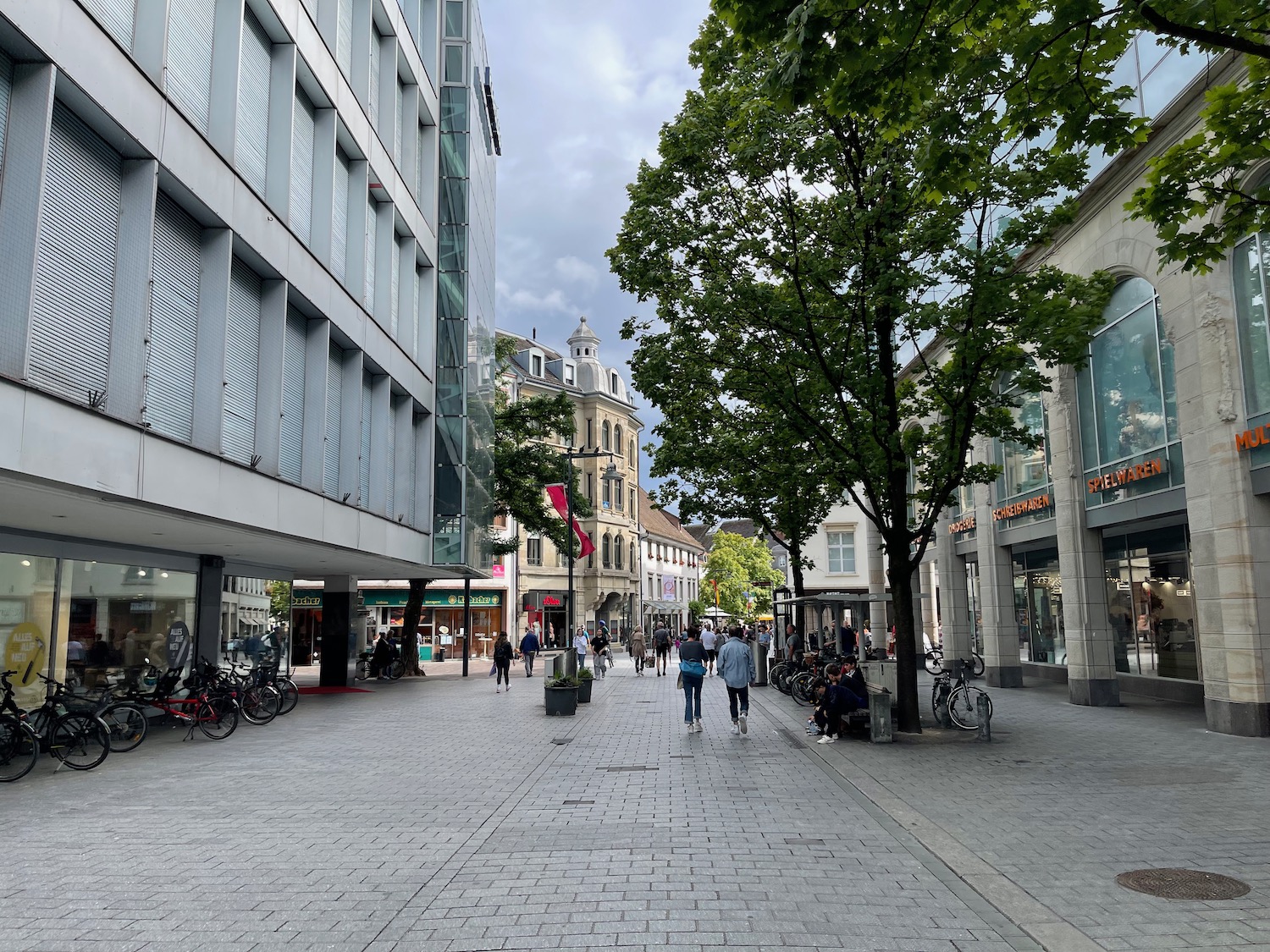 a group of people walking on a street