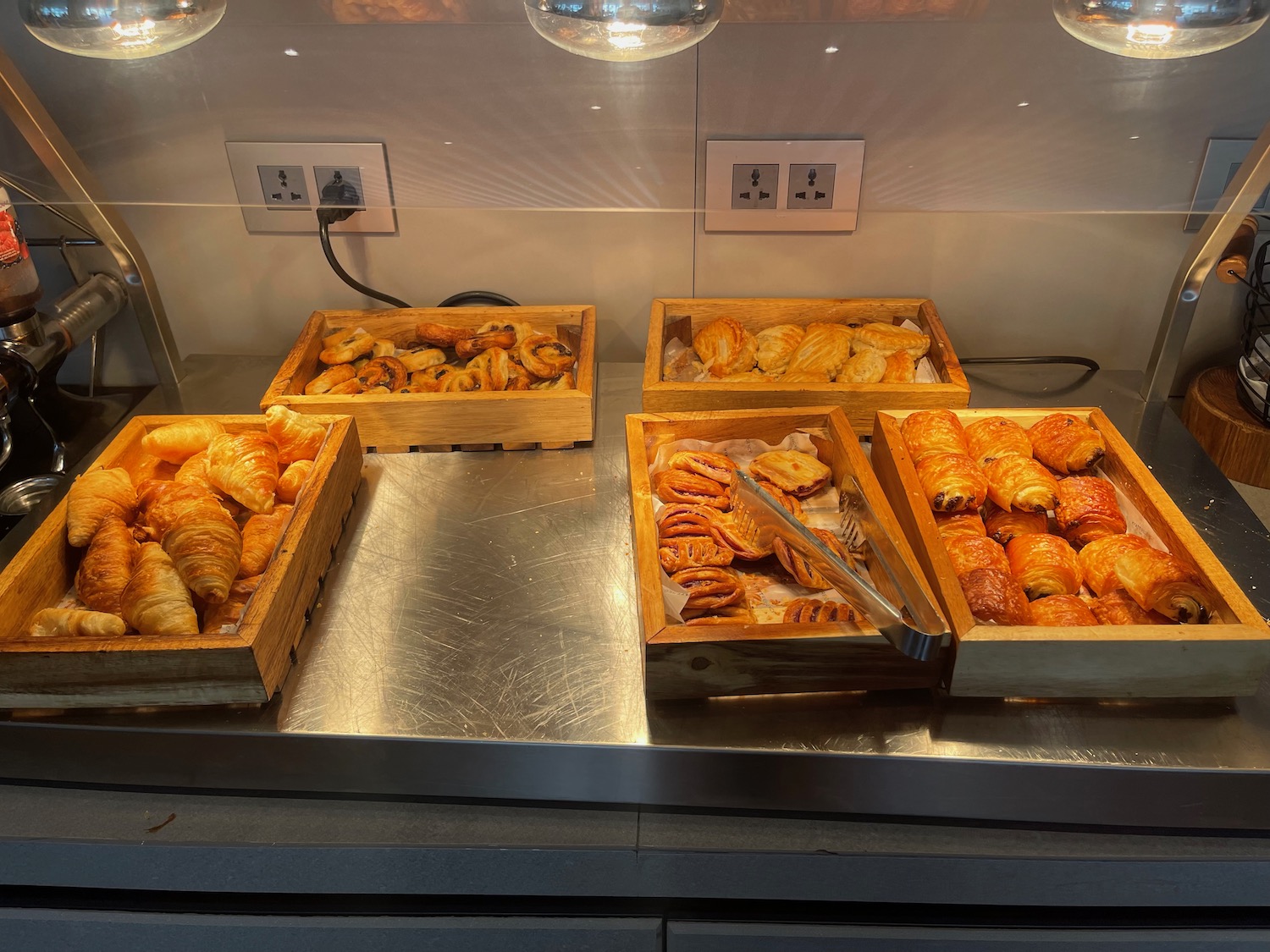 a group of pastries in wooden boxes