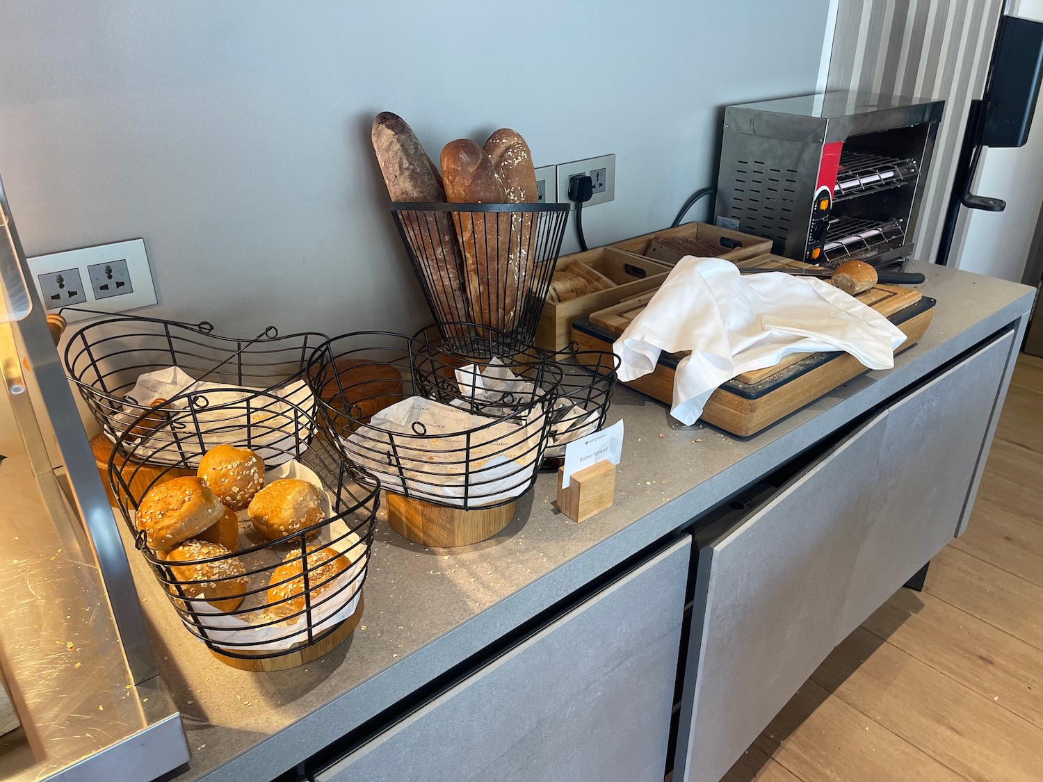 a counter with baskets of bread and bread in it