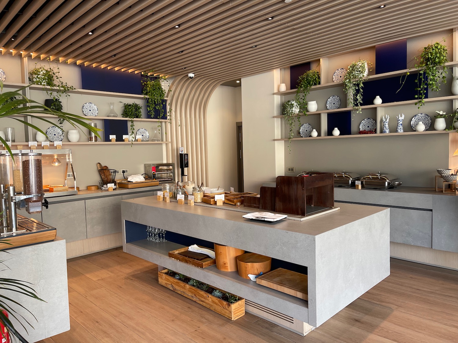 a kitchen with a large counter and shelves