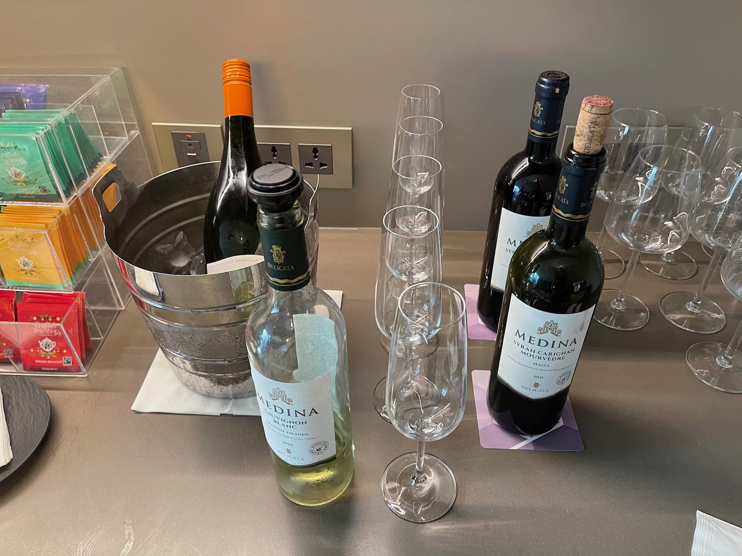 a group of wine bottles and glasses on a table