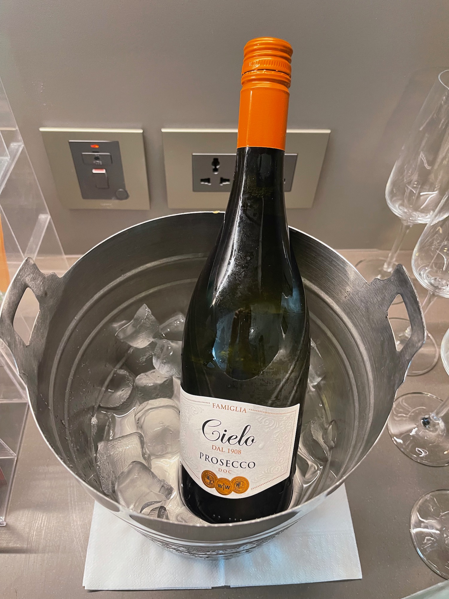 a bottle of wine in a bucket of ice