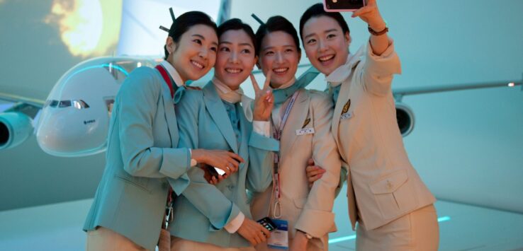 a group of women in uniform taking a selfie