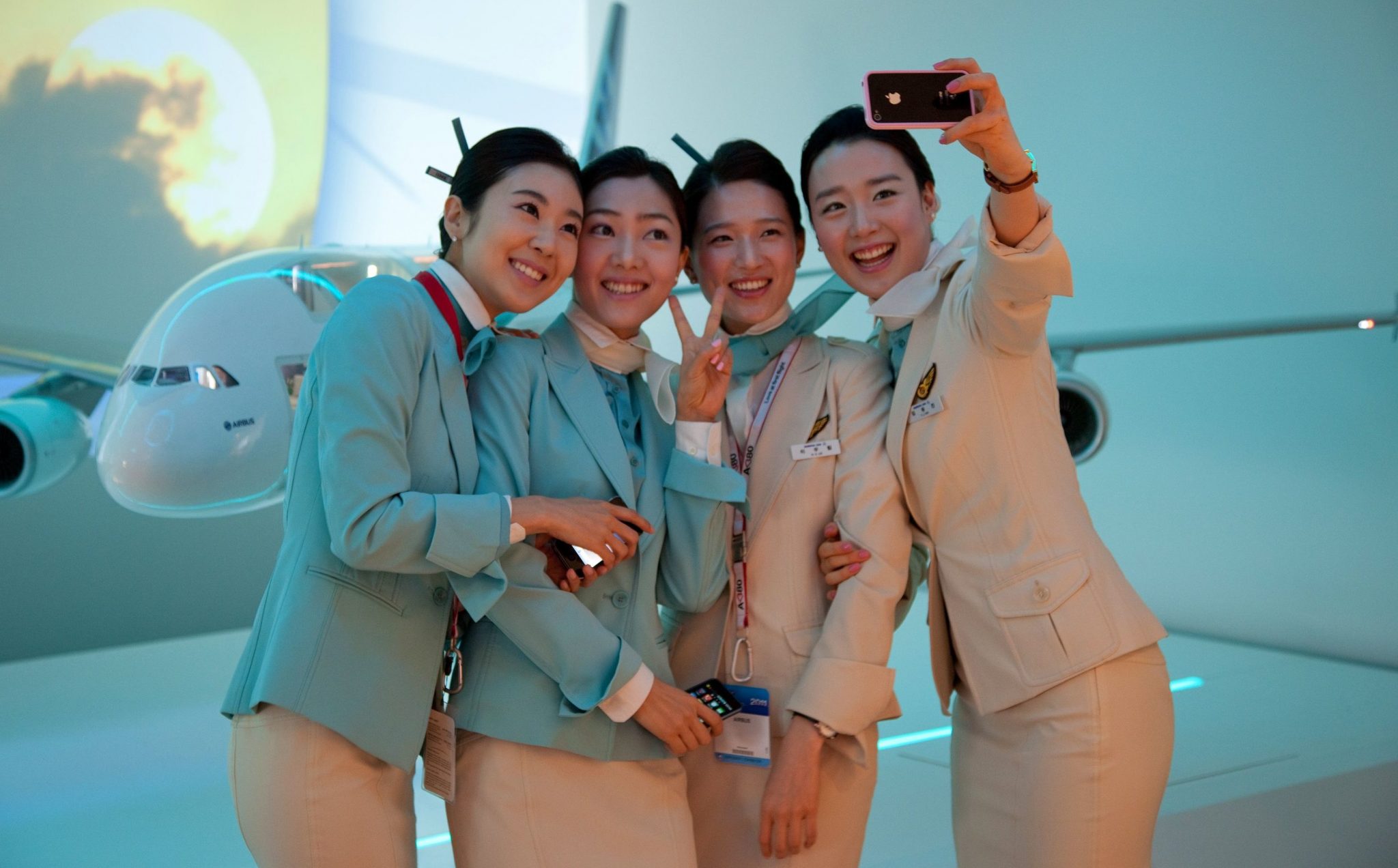 a group of women in uniform taking a selfie