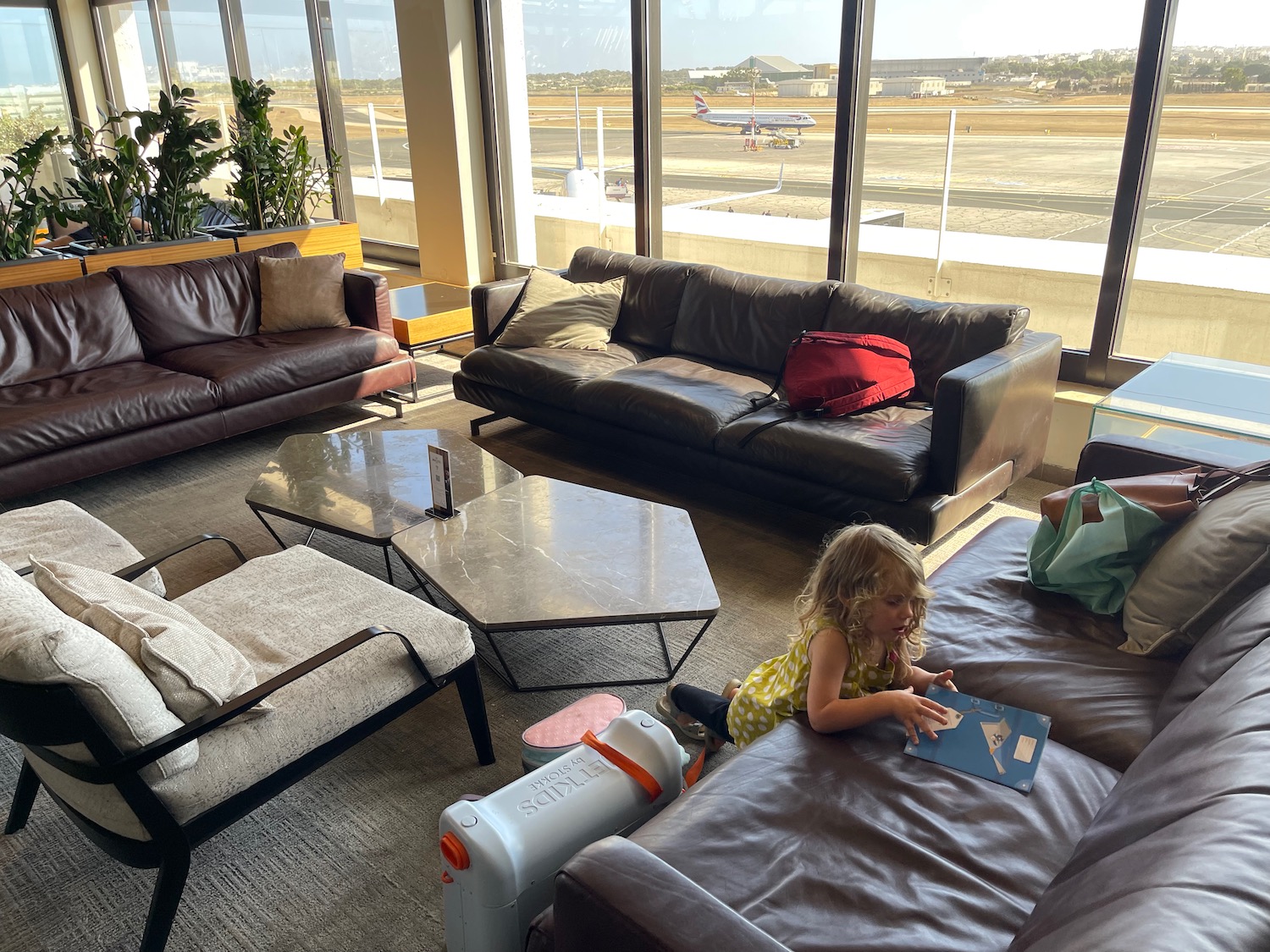 a group of people sitting on couches in a lounge area