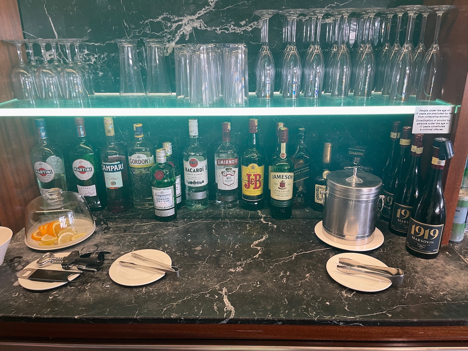 a bar with bottles and glasses on it