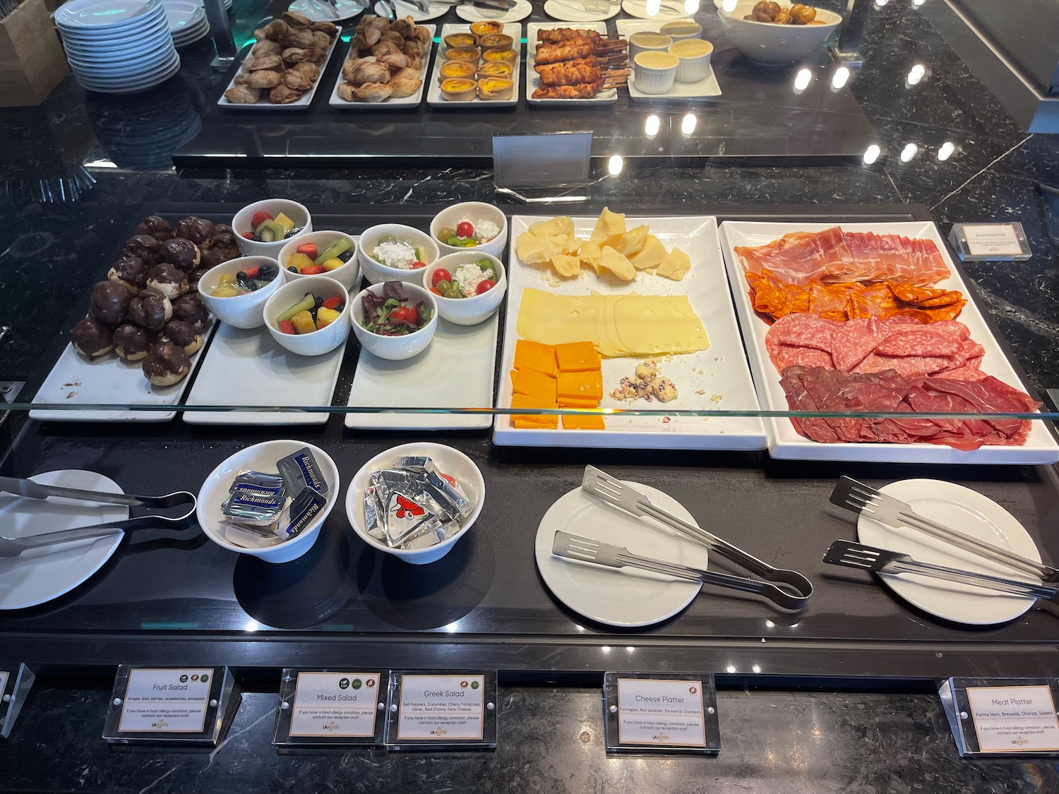 a buffet with different food items on it