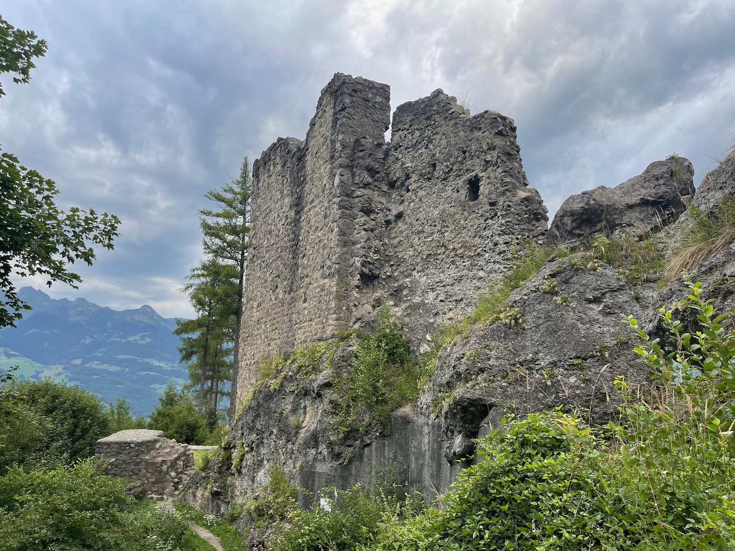 a stone building on a hill