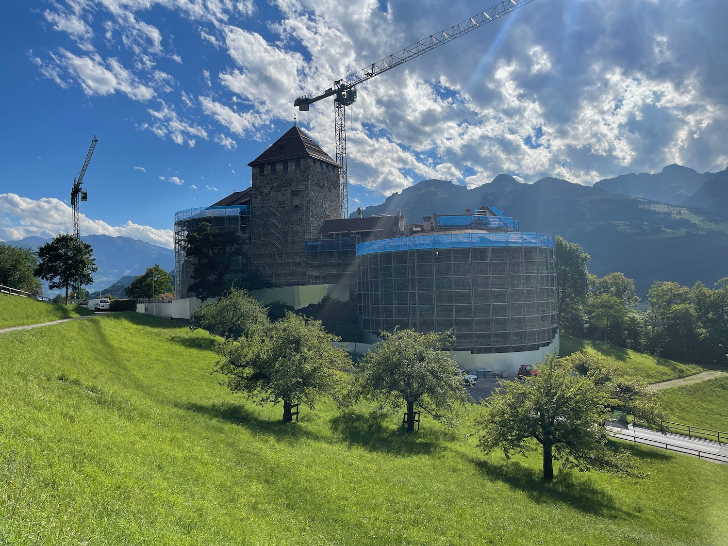 a building under construction in a grassy area