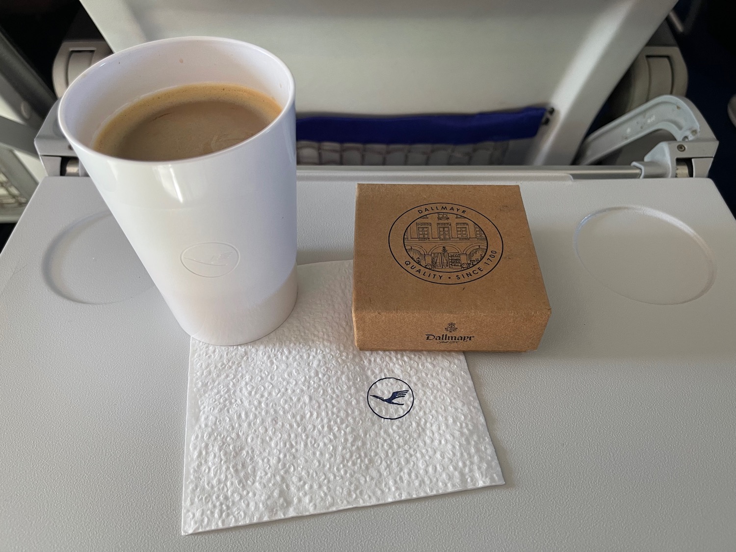 a cup of coffee and a box on a table