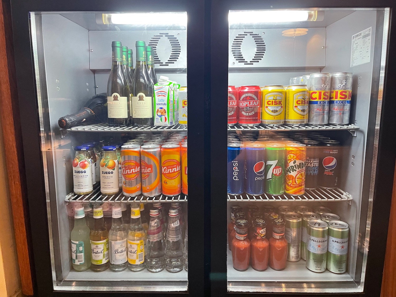 a refrigerator with drinks and beverages