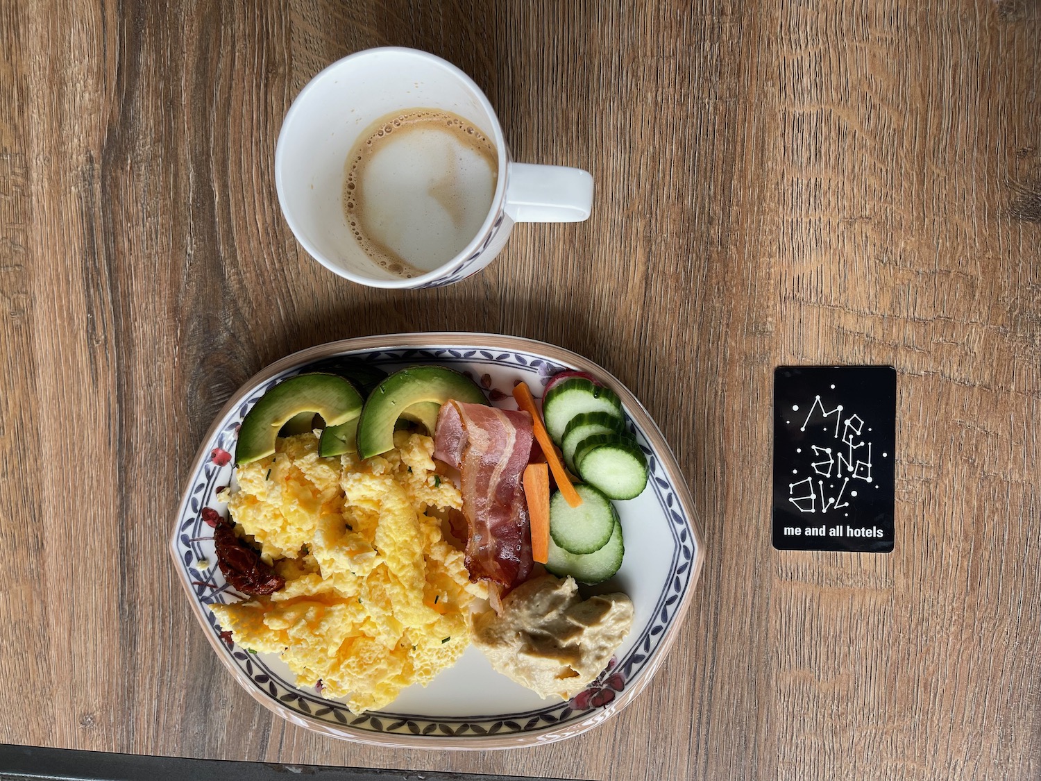 a plate of food and a cup of coffee