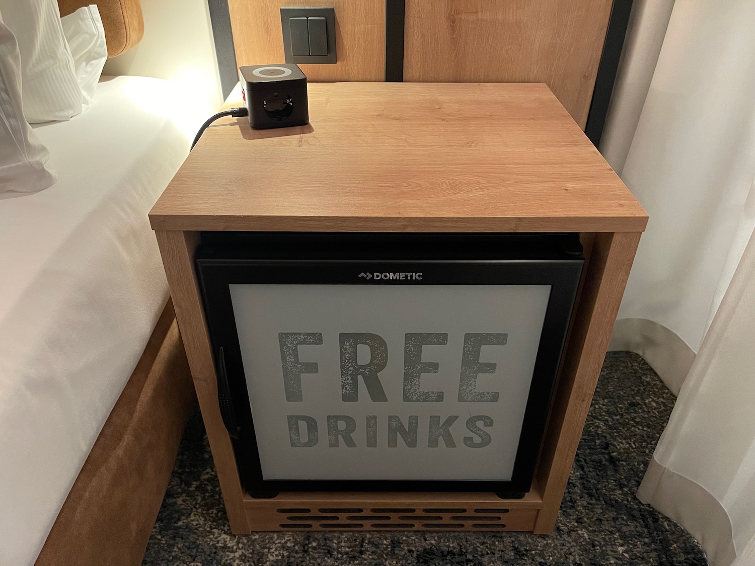 a small wooden box with a square glass door