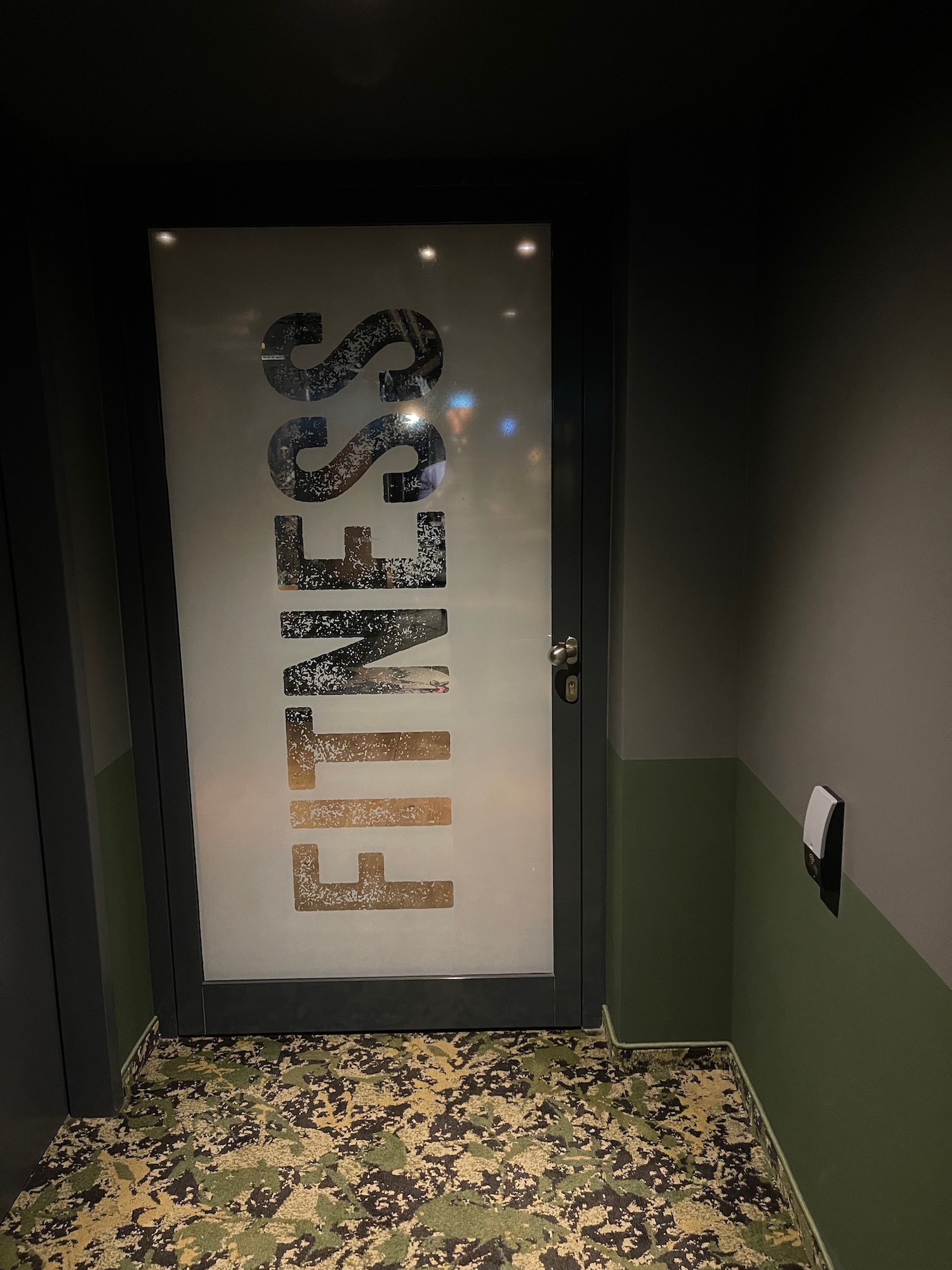 a door with a glass door with a sign on it