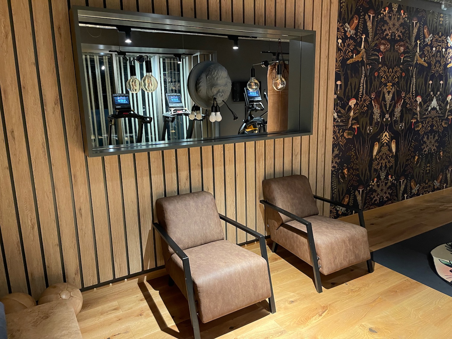 a room with chairs and a mirror