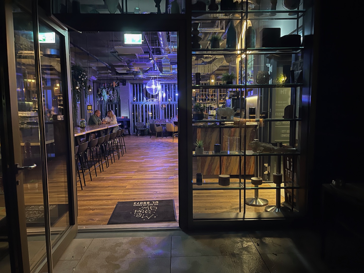 a glass doors leading to a restaurant