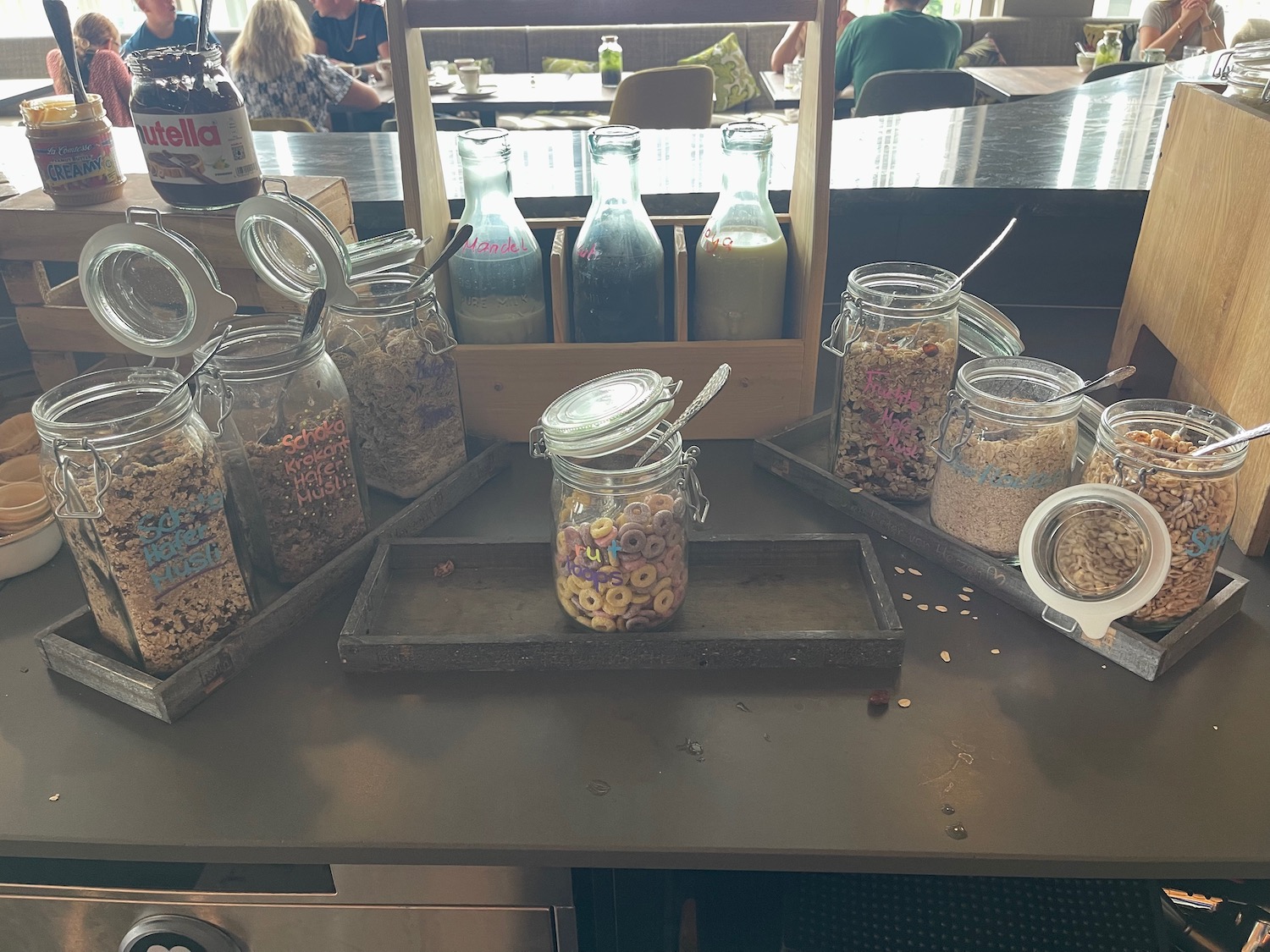 a group of glass jars with cereal and cereal in them