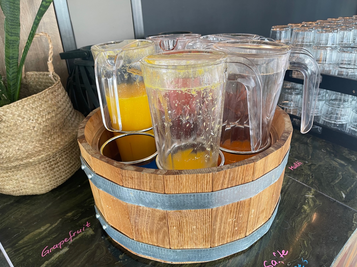 a group of glasses in a wooden barrel