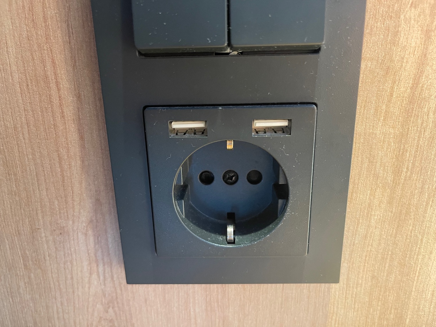 a black electrical outlet with a usb port