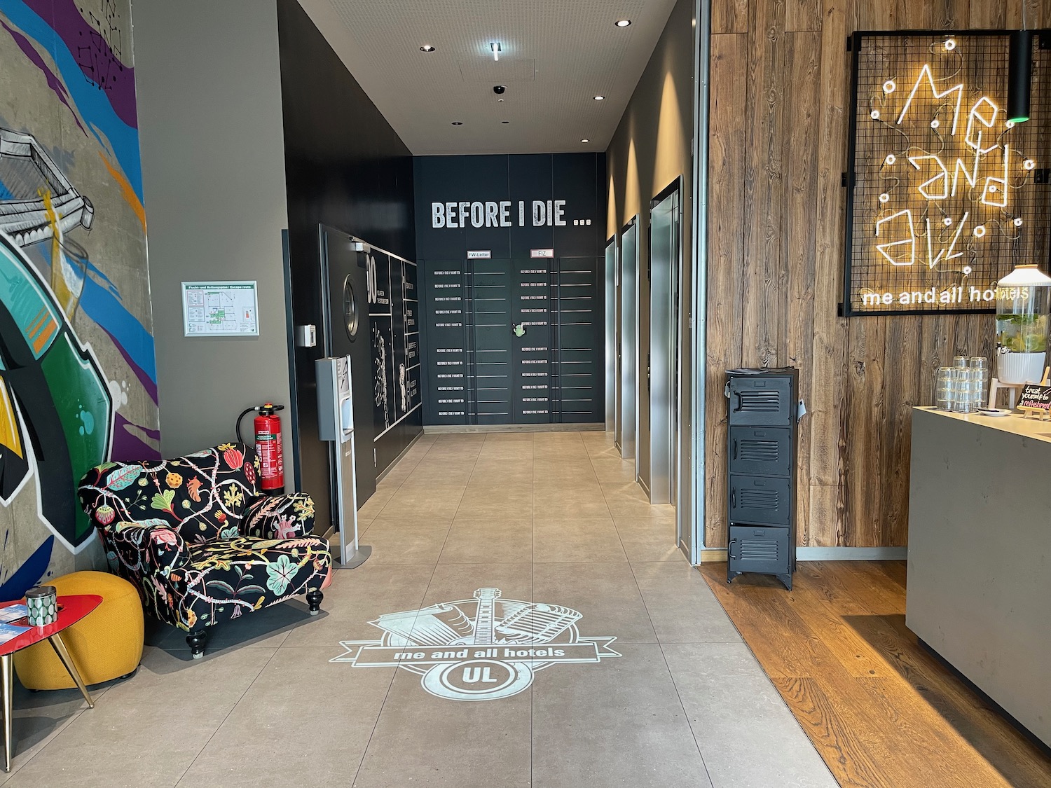 a hallway with lockers and chairs