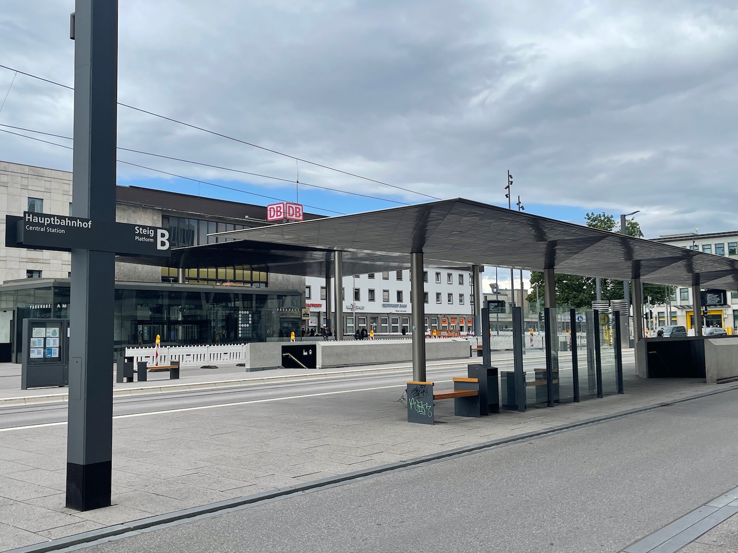 a bus stop with a covered roof