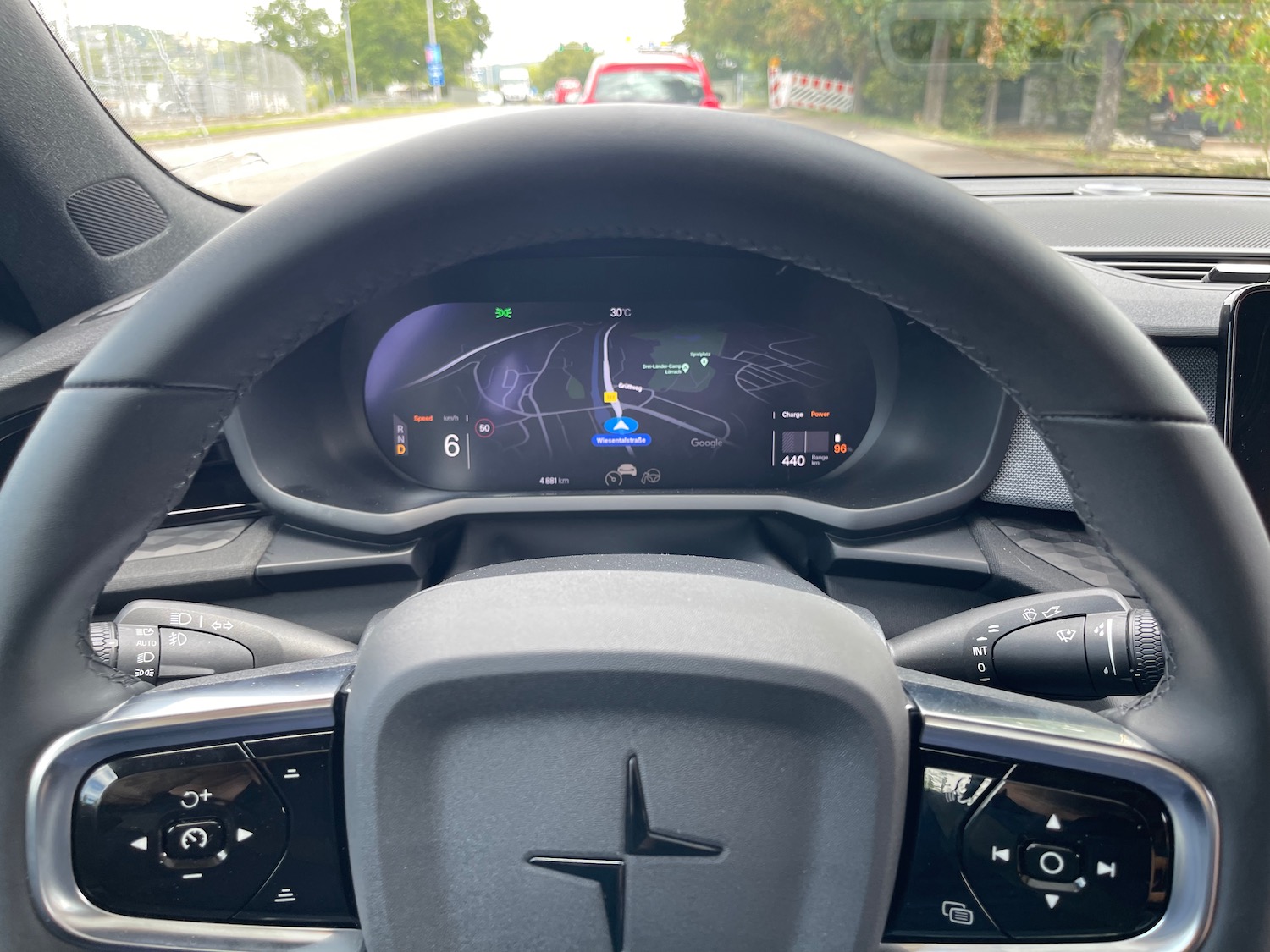 the steering wheel and dashboard of a car