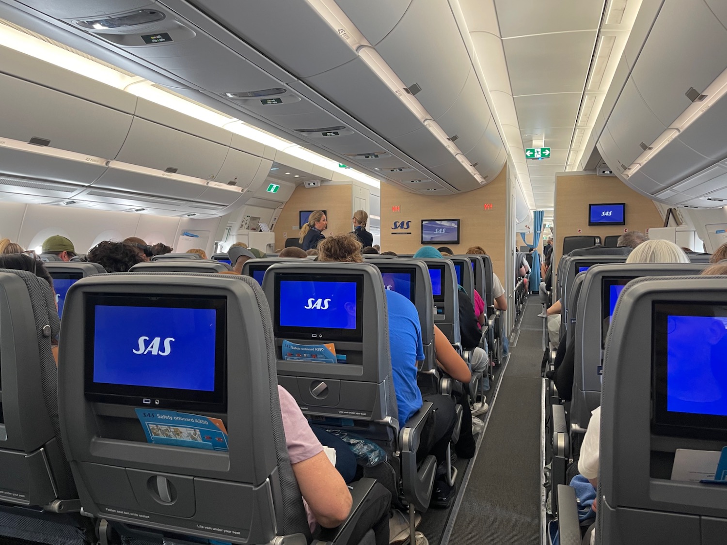 a group of people sitting in an airplane