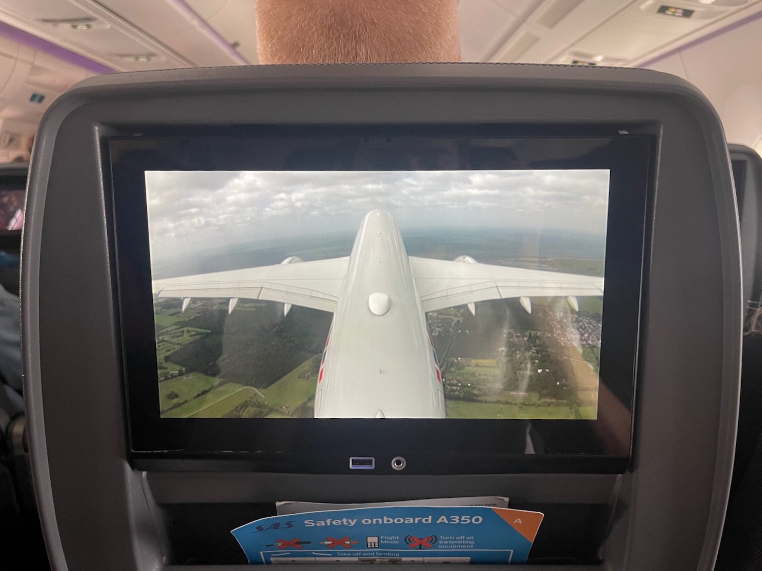 a screen with an airplane in the background