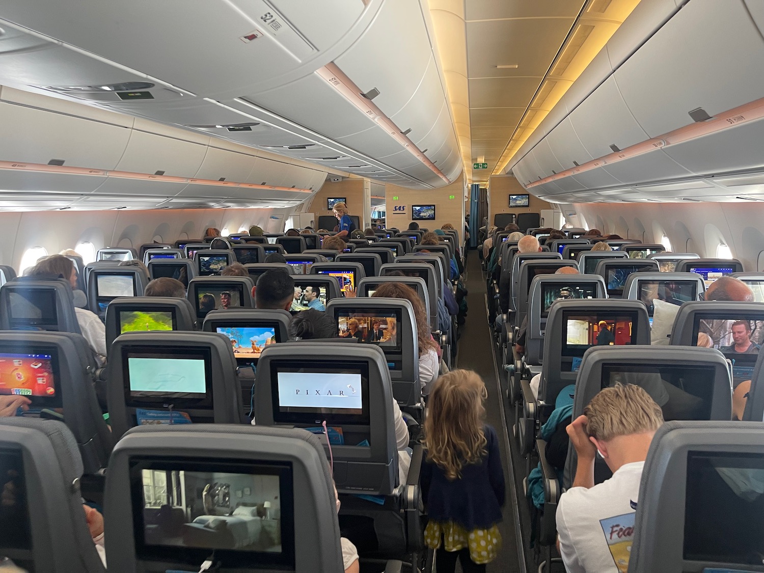 a group of people sitting in an airplane