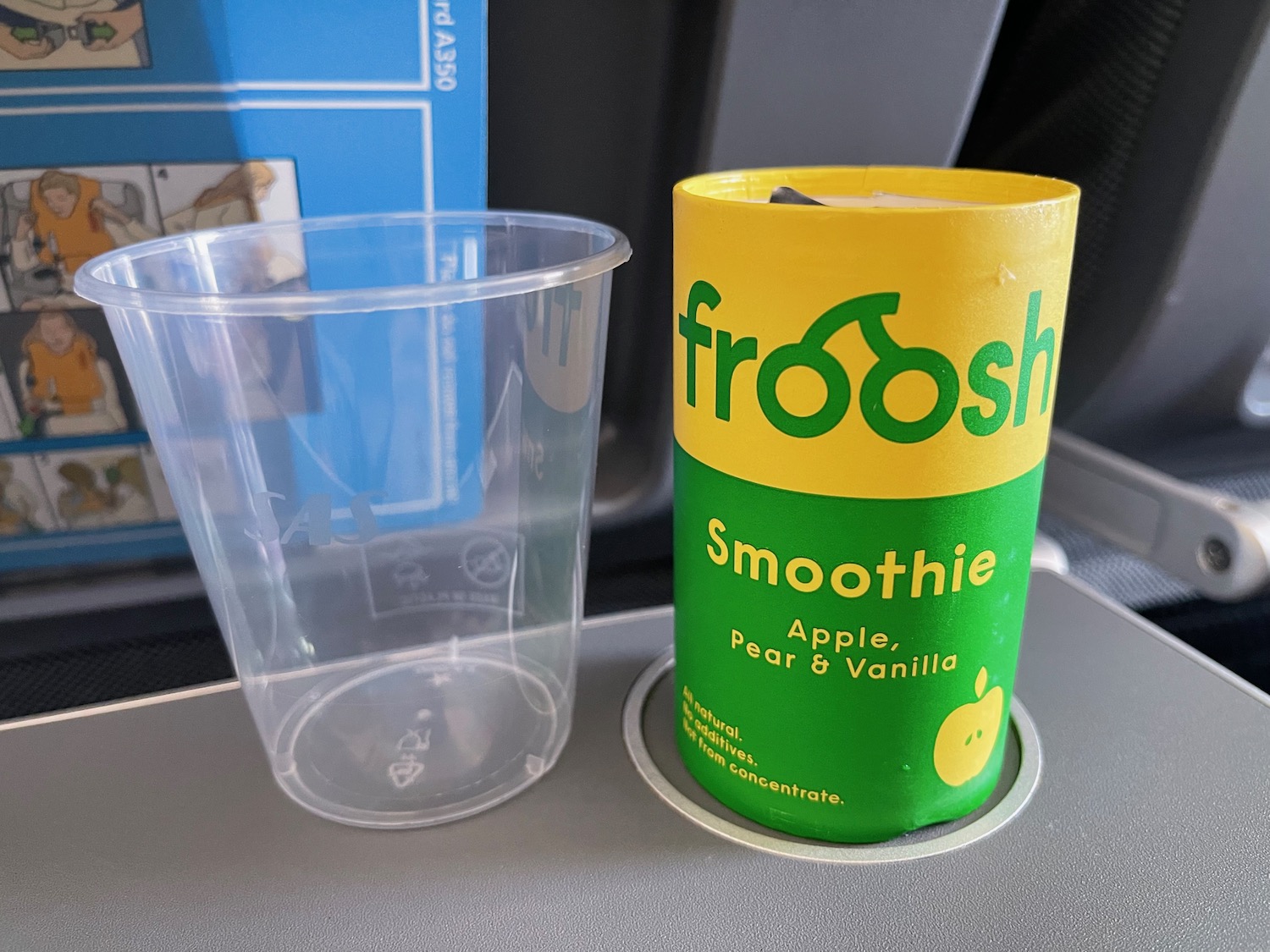 a plastic cup and a container on a table