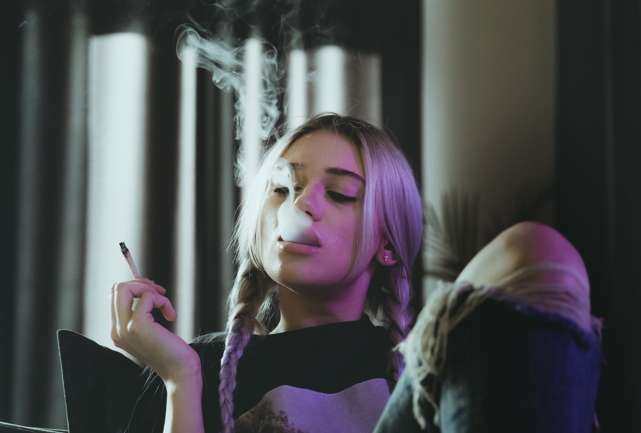a woman smoking a cigarette