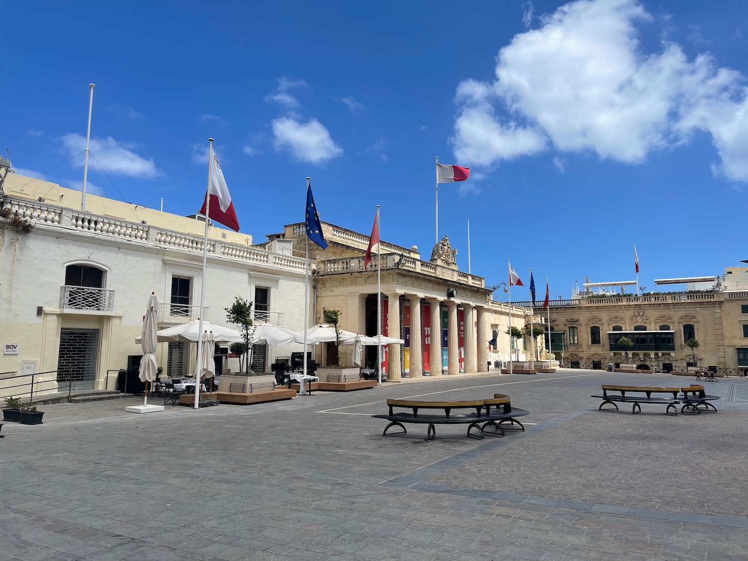 a building with flags on the roof