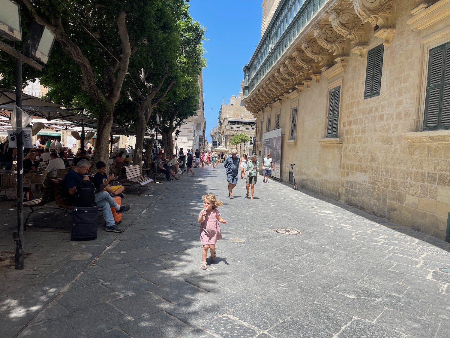 a child walking on a street